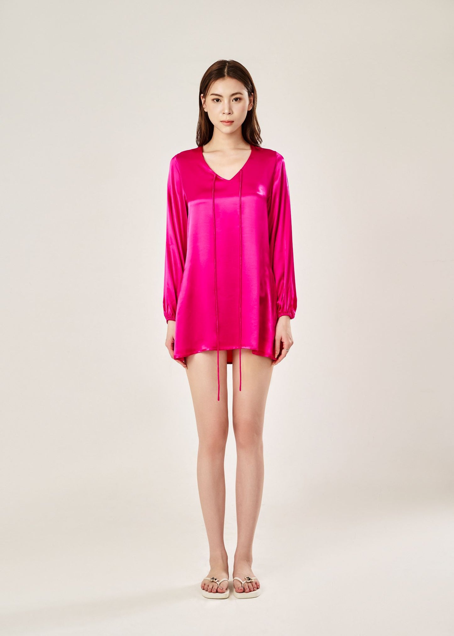 Front view of Cheries Apparel midi shirt dress in raspberry pink, featuring puffed long sleeves, a V-neckline with double-needle stitching, and hidden pockets