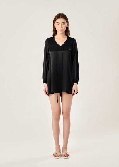 Front view of Cheries Apparel midi shirt dress in black, featuring puffed long sleeves, a V-neckline with double-needle stitching, and hidden pockets