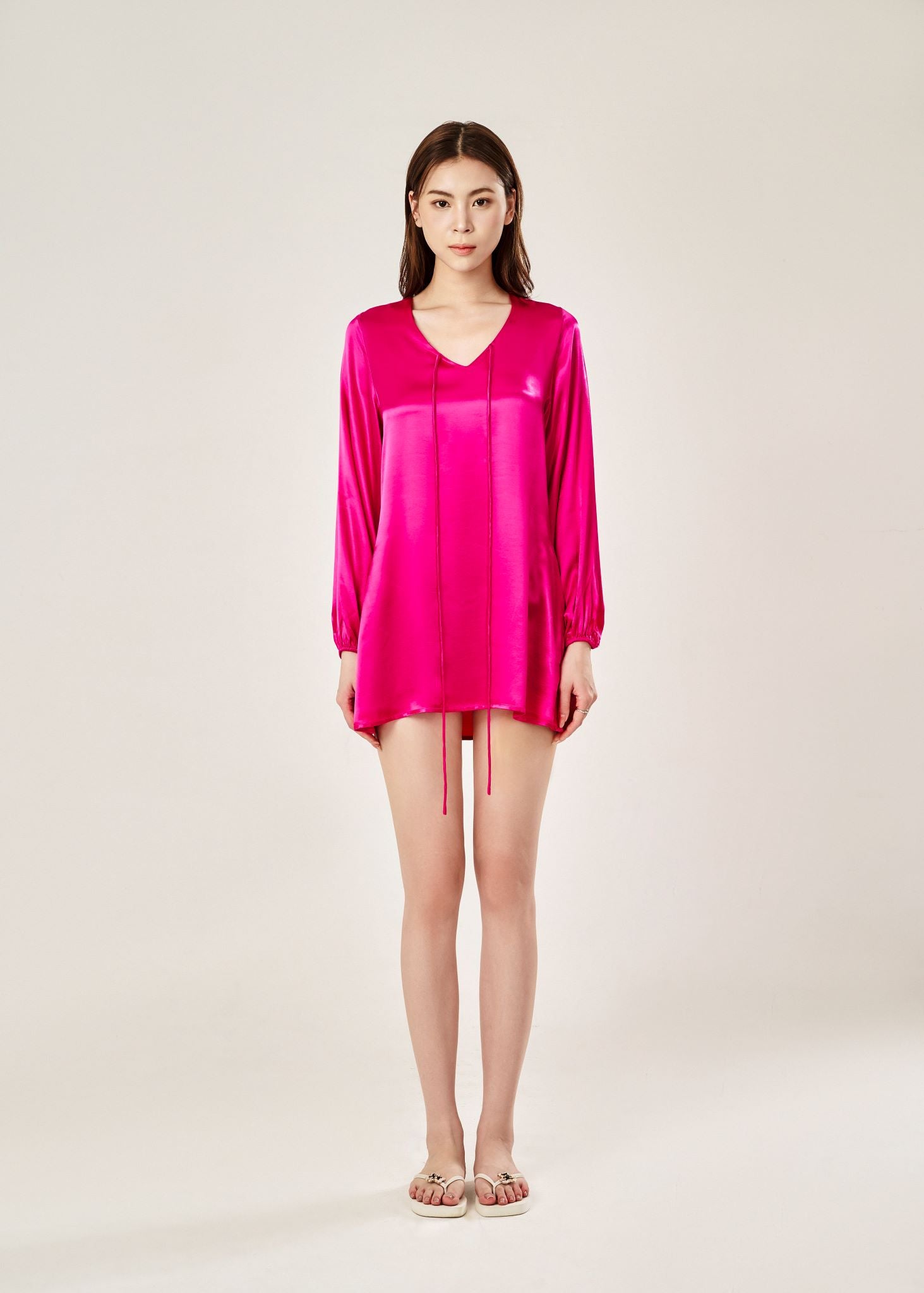 Front view of Cheries Apparel midi shirt dress in raspberry pink, featuring puffed long sleeves, a V-neckline with double-needle stitching, and hidden pockets